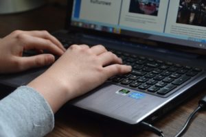 picture of hands on a computer keyboard